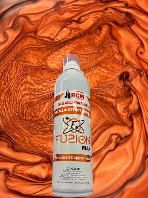 Bottle of RCM Fuzion Max metallic effect paint against an orange swirled background