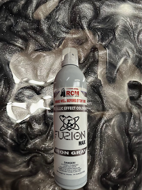 Spray can labeled 'RCM Fuzion Max Iron Gray' on a textured metallic background
